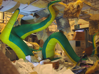 Illustration for article titled Giant Green Tentacles Attack Buildings from the Inside